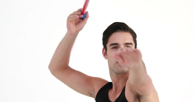 Young Man Enthusiastically Throwing Javelin in Black Tank Top - Download Free Stock Images Pikwizard.com