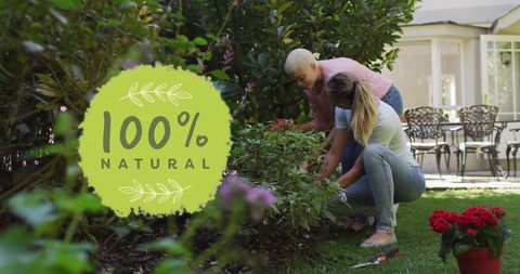 Diverse female couple gardening with 100% natural label