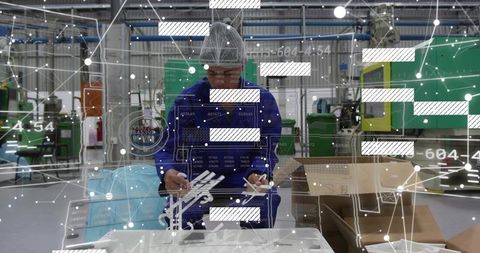 Factory technician inspecting plastic components with augmented reality production overlays