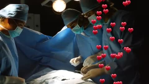 Surgical Team Collaborating with Heart Graphics Foreground