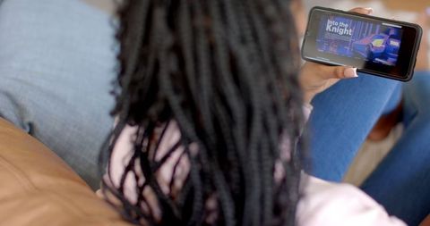 Woman Relaxing on Sofa Watching Streaming Service on Smartphone - Download Free Stock Images Pikwizard.com