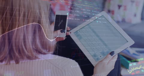 Businesswoman Analyzing Stock Market Using Tablet and Smartphone