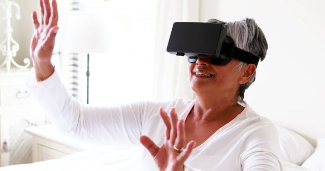 Senior Woman Enjoying Virtual Reality Experience at Home - Download Free Stock Images Pikwizard.com