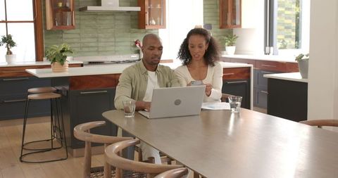 Couple Collaborating on Technology at Home Pool Ideas