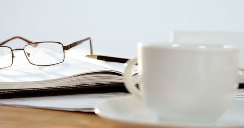 Cozy Workspace with Coffee and Eyeglasses on Organized Desk - Download Free Stock Images Pikwizard.com