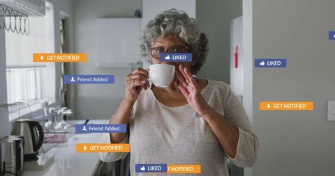 Senior Woman Enjoying Coffee with Digital Notifications at Home