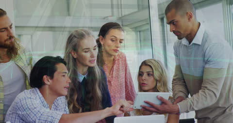 Diverse Team Analyzing Digital Business Data on Tablet