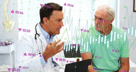 Doctor consulting senior patient while analyzing digital health data and vital charts