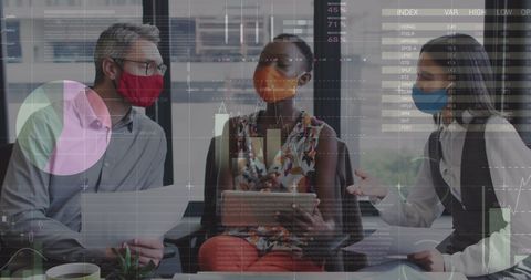 Diverse Professionals Analyzing Data During Meeting