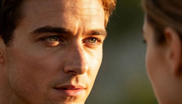 Intense male gaze closeup green eyes golden hour romantic tension couple portrait