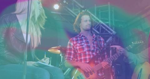 Live Music Performance with Guitarist and Elegant Lighting Effects