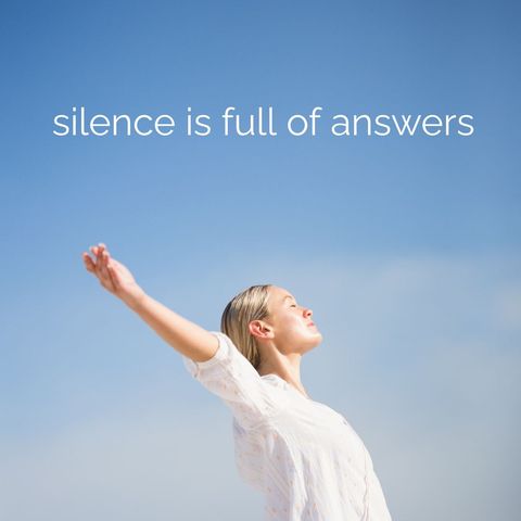 Woman embracing silence and calm against blue sky