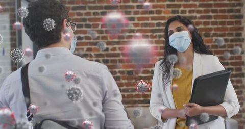 Colleagues in Masks Dodging Covid-19 Virus Particles