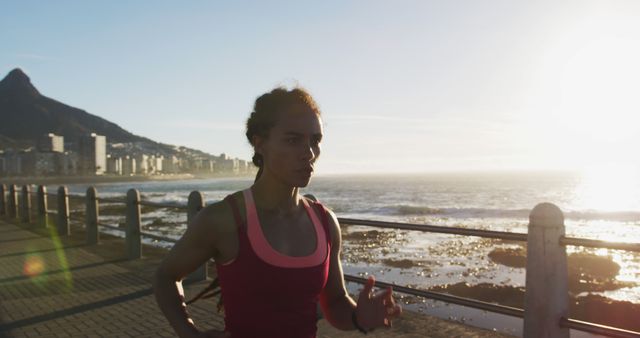 Woman Jogging Along Oceanfront at Sunrise - Download Free Stock Images Pikwizard.com