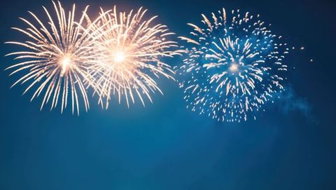 Vibrant Firework Bursts Against Night Sky