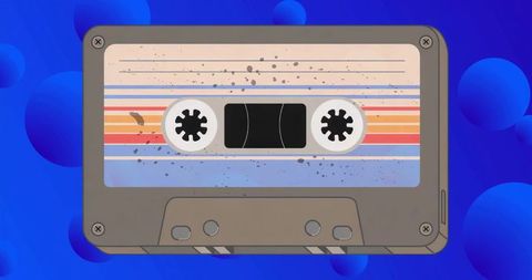 Vintage cassette tape featuring colorful striped label on vivid blue abstract backdrop