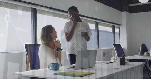 Diverse Colleagues Discussing Business Ideas in Modern Office