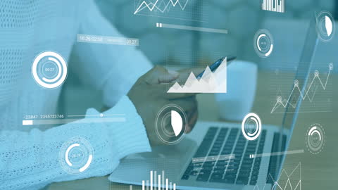 Businessman Analyzing Data with Smartphone and Laptop