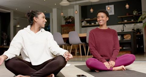 Diverse Women Practicing Mindfulness Yoga at Home