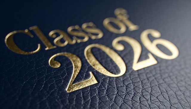 Gold foil class of 2026 embossed on navy leather cover closeup