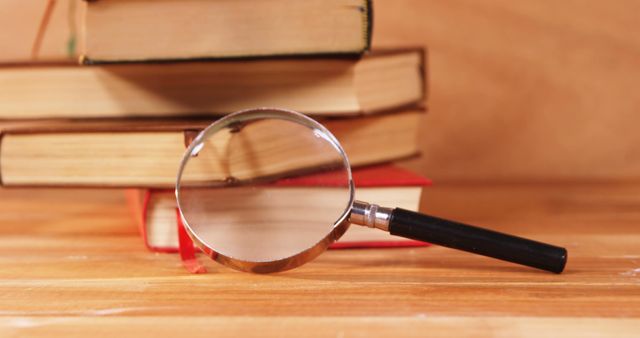 Vintage Magnifying Glass and Books on Wooden Surface - Download Free Stock Images Pikwizard.com