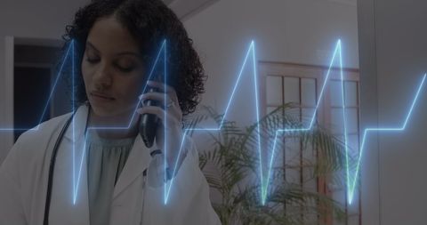 Doctor Discussing Medical Findings with EKG Graphic Display