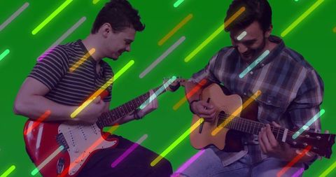 Dynamic Duet: Musicians Strumming Electric and Acoustic Guitars