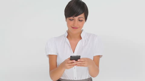 Smiling Businesswoman Typing Message on Modern Smartphone