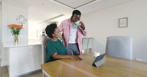 Couple Engaging in Video Call with Tablet in Modern Home Setting