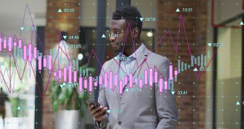 Businessman Analyzing Data on Smartphone with Graphs Overlaid