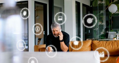 Caucasian Businessman Engaging with Digital Data Interfaces in Modern Office