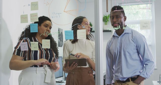 Diverse Team Collaborating on Business Project with Transparent Board - Download Free Stock Images Pikwizard.com