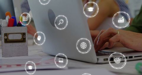 Hands typing on laptop with floating digital icons for teamwork and productivity