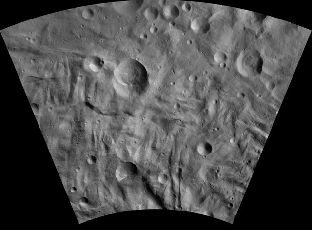 This image of Eusebia AV-L-27, from the atlas of the giant asteroid Vesta, was created from images taken as NASA Dawn mission flew around the object, also known as a protoplanet. The set of maps was created from mosaics of10,000 images from Dawn's framing camera instrument, taken at a low altitude of about 130 miles (210 kilometers). This map is mostly at a scale about that of regional road touring maps, where every inch of map is equivalent to a little more than 3 miles of asteroid (one centimeter equals 2 kilometers).  http://photojournal.jpl.nasa.gov/catalog/PIA19531