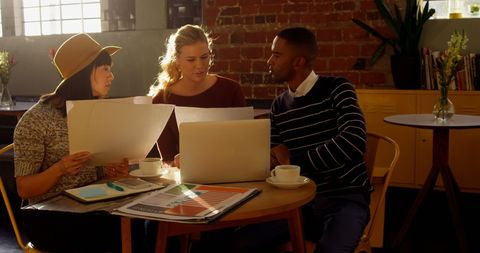 Diverse Young Professionals Collaborating in Casual Office