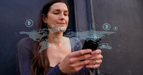 Woman Engaging in Bitcoin Trading on Smartphone with Global Digital Overlay