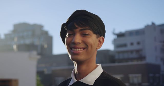 Smiling Young Man in Urban Outdoor Setting with Modern Building Background - Download Free Stock Images Pikwizard.com