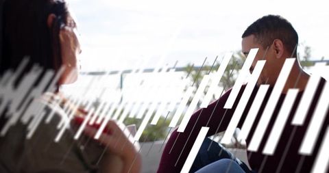 Two women chatting and relaxing on waterfront balcony with white bar graphic overlay