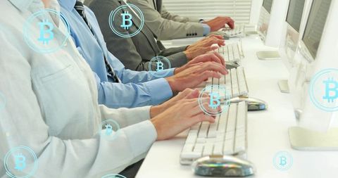 Typing Team Processing Bitcoin Transactions on White Keyboards in Modern Office