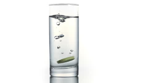 Fizzing Tablet in Clear Water in Super Slow Motion