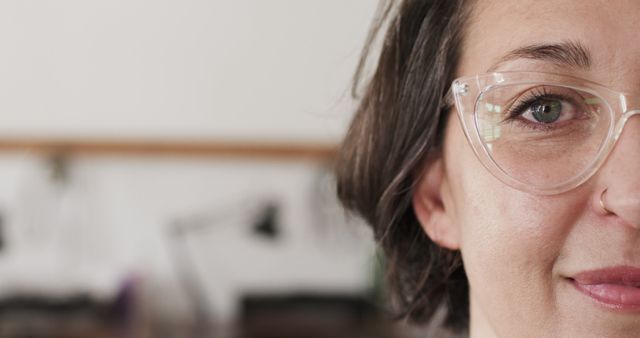 Close-Up of a Smiling Woman with Glasses in Office - Download Free Stock Images Pikwizard.com