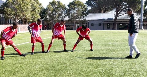 Team Players Warming Up Before Soccer Practice