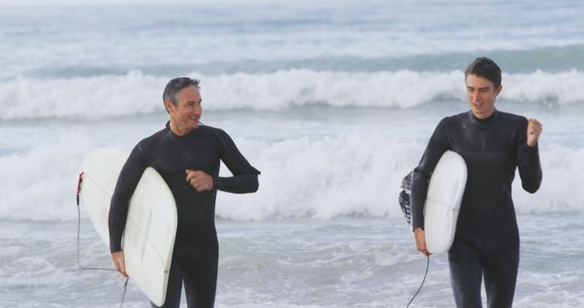 Father and Son Surfing Together on a Sunny Day - Download Free Stock Photos Pikwizard.com
