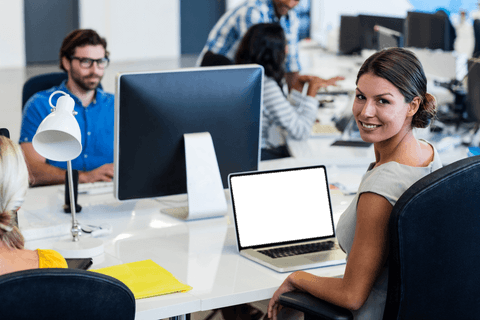 businesswoman smiling at transparent desk with busy team at open office - Download Free Stock Videos Pikwizard.com