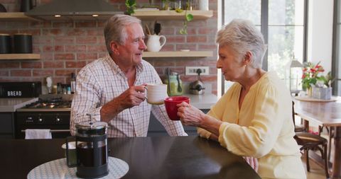 Senior Couple Enjoying Coffee in Modern Kitchen - Download Free Stock Images Pikwizard.com