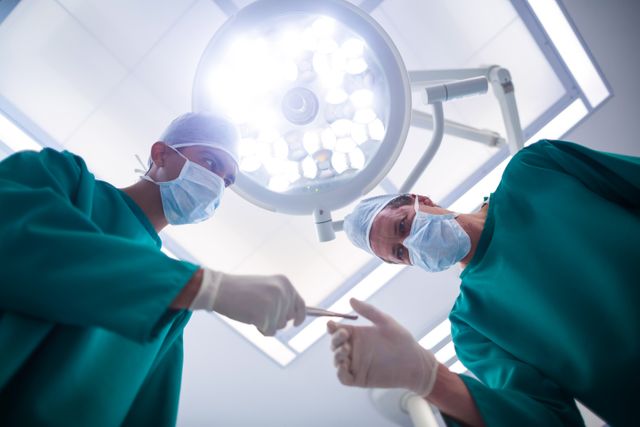 Surgeons operating in operation theater in hospital
