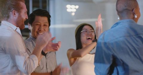 Diverse Team Celebrating Success with Enthusiastic Applause in Office