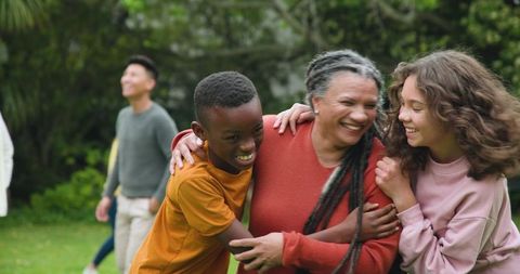 Joyful Family Bonding in Sunlit Backyard Gathering