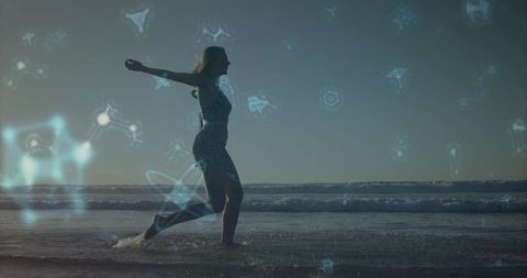 Backlit woman leaping along shoreline with blue holographic overlays at sunrise