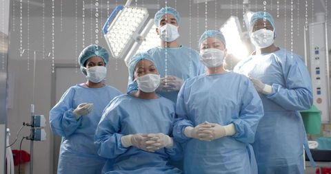 Multicultural surgical team preparing for high-tech operation with digital binary overlay